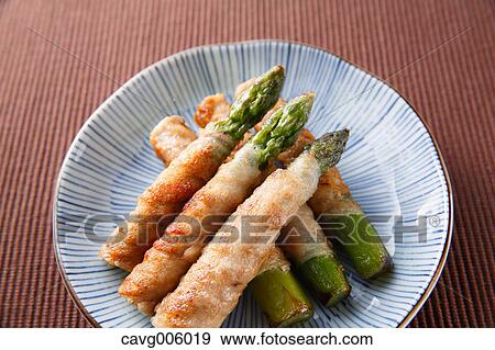 Stock Photo - Meat-rolled asparagus. Fotosearch