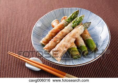 Stock Photograph - Meat-rolled asparagus. Fotosearch