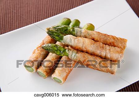 Stock Photography - Meat-rolled asparagus. Fotosearch