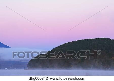 Morning fog over lake Yamanaka, Yamanashi Prefecture, Japan View Large Photo Image Stock Image - Morning fog over lake Yamanaka, Yamanashi Prefecture, Japan. Fotosearch