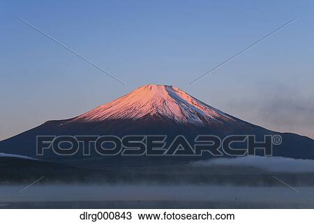 Stock Image - Morning light illuminating Mount Fuji at Lake Yamanaka, Yamanashi Prefecture, Japan. Fotosearch