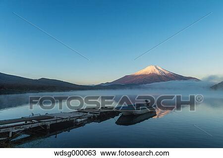 Morning light illuminating Mount Fuji at Lake Yamanaka, Yamanashi Prefecture, Japan View Large Photo Image Stock Image - Morning light illuminating Mount Fuji at Lake Yamanaka, Yamanashi Prefecture, Japan. Fotosearch
