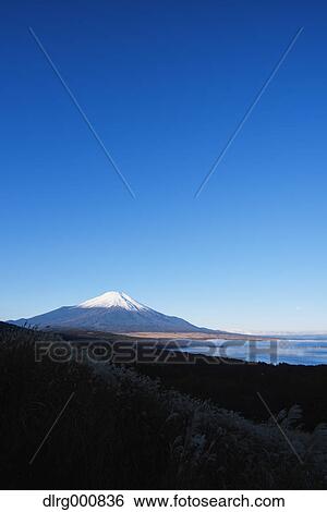 Morning light illuminating Mount Fuji and Lake Yamanaka, Yamanashi Prefecture, Japan View Large Photo Image Stock Photograph - Morning light illuminating Mount Fuji and Lake Yamanaka, Yamanashi Prefecture, Japan. Fotosearch