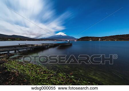 Night view of cloudy sky and Mount Fuji at night from Lake Yamanaka, Yamanashi Prefecture, Japan View Large Photo Image Stock Photography - Night view of cloudy sky and Mount Fuji at night from Lake Yamanaka, Yamanashi Prefecture, Japan. Fotosearch
