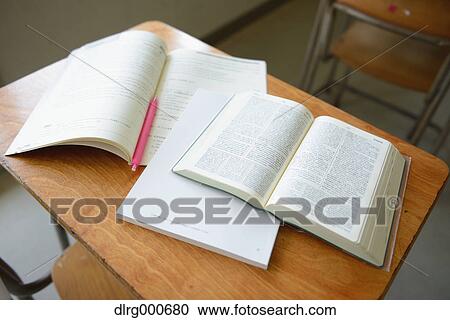 Stock Image - Notebook on school desk. Fotosearch