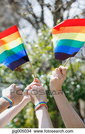 People with rainbow flags View Large Photo Image Picture - People with rainbow flags. Fotosearch
