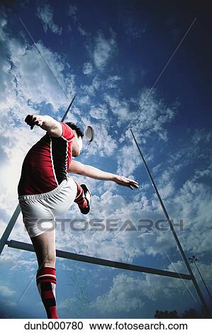 Stock Image - Portrait of Japanese rugby player kicking. Fotosearch