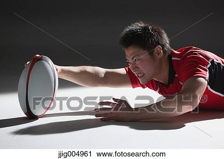 Portrait of Japanese rugby player diving to score a try View Large Photo Image Stock Image - Portrait of Japanese rugby player diving to score a try. Fotosearch
