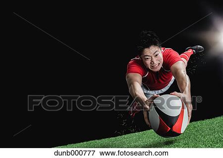 Portrait of Japanese rugby player diving to score a try View Large Photo Image Stock Photo - Portrait of Japanese rugby player diving to score a try. Fotosearch