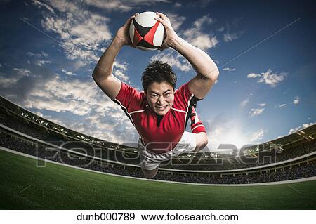 Portrait of Japanese rugby player diving to score a try View Large Photo Image Stock Photo - Portrait of Japanese rugby player diving to score a try. Fotosearch