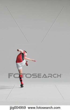 Portrait of Japanese rugby player kicking View Large Photo Image Stock Photo - Portrait of Japanese rugby player kicking. Fotosearch