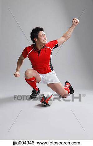Portrait of Japanese rugby player cheering up View Large Photo Image Stock Photograph - Portrait of Japanese rugby player cheering up. Fotosearch