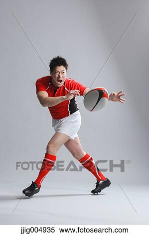 Portrait of Japanese rugby player throwing ball View Large Photo Image Stock Photography - Portrait of Japanese rugby player throwing ball. Fotosearch