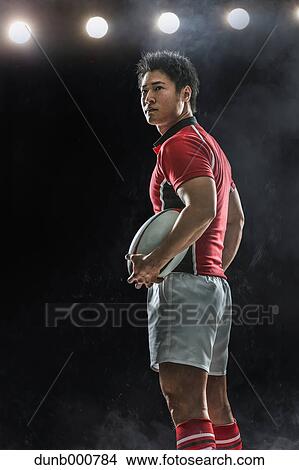 Portrait of Japanese rugby player with ball View Large Photo Image Picture - Portrait of Japanese rugby player with ball. Fotosearch