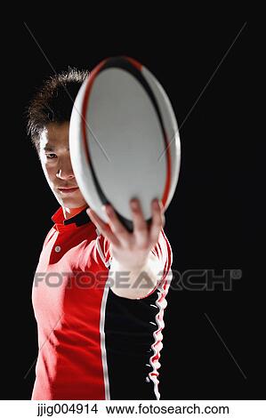 Portrait of Japanese rugby player with ball View Large Photo Image Picture - Portrait of Japanese rugby player with ball. Fotosearch