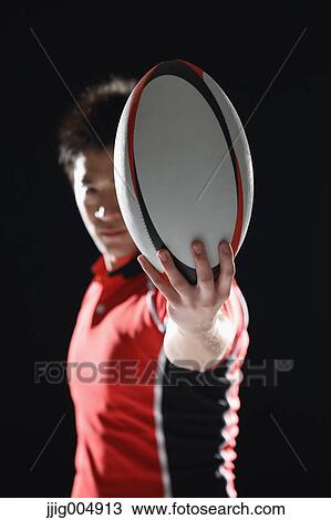 Portrait of Japanese rugby player with ball View Large Photo Image Stock Image - Portrait of Japanese rugby player with ball. Fotosearch