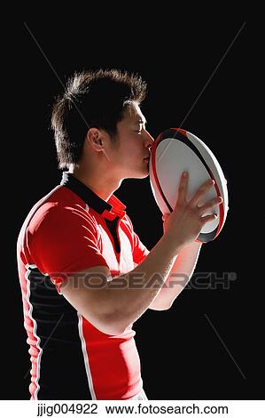 Portrait of Japanese rugby player with ball View Large Photo Image Stock Image - Portrait of Japanese rugby player with ball. Fotosearch