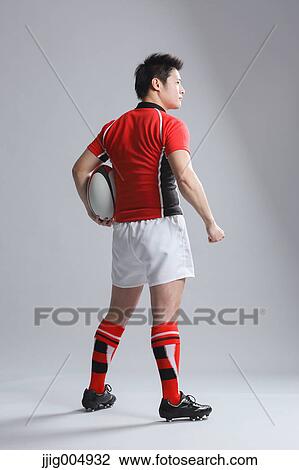Portrait of Japanese rugby player with ball View Large Photo Image Stock Image - Portrait of Japanese rugby player with ball. Fotosearch
