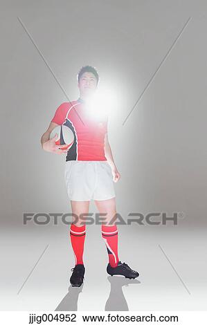 Portrait of Japanese rugby player with ball View Large Photo Image Stock Image - Portrait of Japanese rugby player with ball. Fotosearch