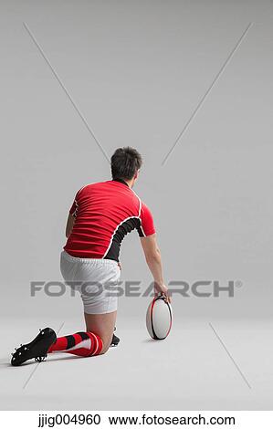 Portrait of Japanese rugby player with ball View Large Photo Image Stock Image - Portrait of Japanese rugby player with ball. Fotosearch