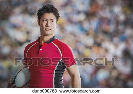Portrait of Japanese rugby player with ball View Large Photo Image Stock Photo - Portrait of Japanese rugby player with ball. Fotosearch