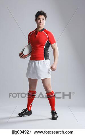 Portrait of Japanese rugby player with ball View Large Photo Image Stock Photo - Portrait of Japanese rugby player with ball. Fotosearch