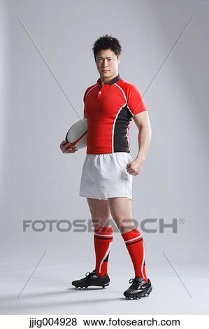 Portrait of Japanese rugby player with ball View Large Photo Image Stock Photo - Portrait of Japanese rugby player with ball. Fotosearch