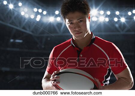 Portrait of Japanese rugby player with ball View Large Photo Image Stock Photograph - Portrait of Japanese rugby player with ball. Fotosearch
