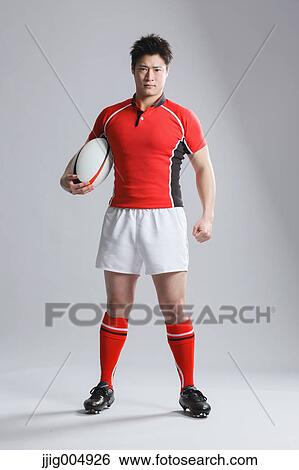 Portrait of Japanese rugby player with ball View Large Photo Image Stock Photograph - Portrait of Japanese rugby player with ball. Fotosearch