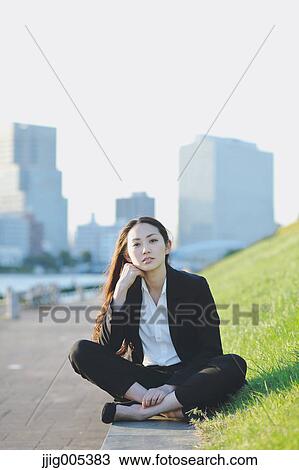 Portrait of young Japanese businesswoman by a river downtown Tokyo View Large Photo Image Stock Image - Portrait of young Japanese businesswoman by a river downtown Tokyo. Fotosearch