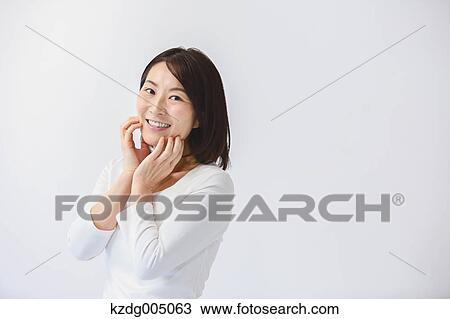 Stock Image - Senior Japanese woman portrait. Fotosearch