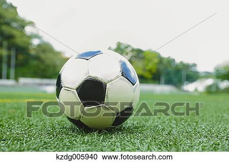 Stock Image - Soccer ball on grass. Fotosearch