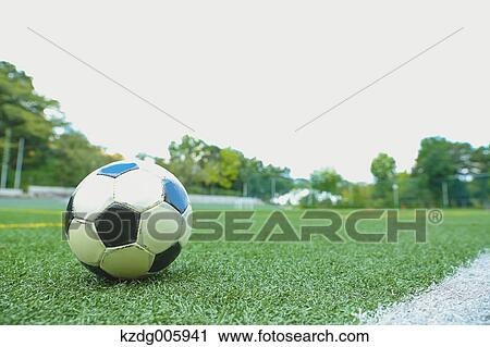 Stock Image - Soccer ball on grass. Fotosearch