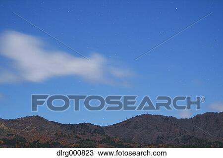Stars in the night sky over a hill, Yamanashi Prefecture, Japan View Large Photo Image Stock Image - Stars in the night sky over a hill, Yamanashi Prefecture, Japan. Fotosearch