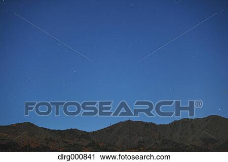 Stars in the night sky over a hill, Yamanashi Prefecture, Japan View Large Photo Image Stock Image - Stars in the night sky over a hill, Yamanashi Prefecture, Japan. Fotosearch