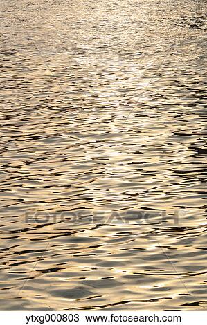 Sunlight reflecting on water View Large Photo Image Stock Image - Sunlight reflecting on water. Fotosearch