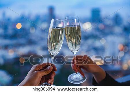 Toasting with champagne in front of Tokyo cityscape View Large Photo Image Picture - Toasting with champagne in front of Tokyo cityscape. Fotosearch