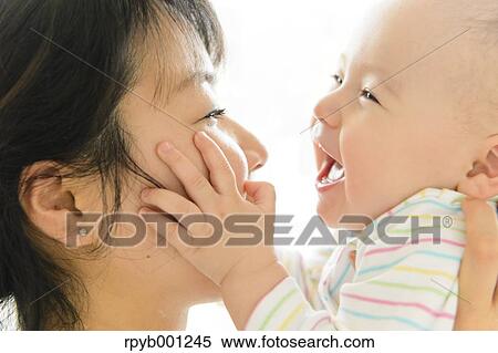 Toddler with mum in the house View Large Photo Image Stock Photography - Toddler with mum in the house. Fotosearch