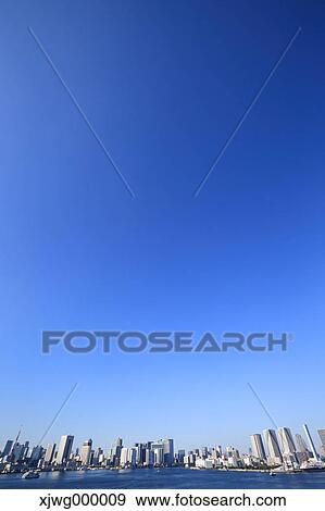 Stock Photo - Tokyo cityscape and blue sky, Tokyo, Japan. Fotosearch
