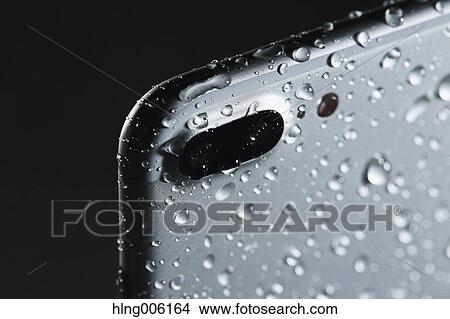 Waterproof smartphone covered with water View Large Photo Image Picture - Waterproof smartphone covered with water. Fotosearch