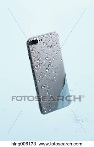 Waterproof smartphone covered with water View Large Photo Image Stock Image - Waterproof smartphone covered with water. Fotosearch