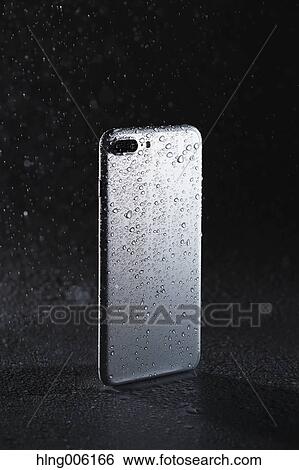 Waterproof smartphone covered with water View Large Photo Image Stock Photograph - Waterproof smartphone covered with water. Fotosearch