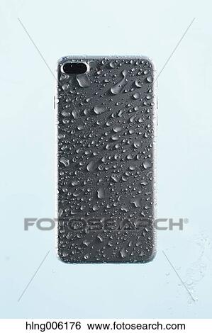 Waterproof smartphone covered with water View Large Photo Image Stock Photograph - Waterproof smartphone covered with water. Fotosearch