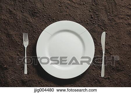 White plate on soil View Large Photo Image Stock Image - White plate on soil. Fotosearch