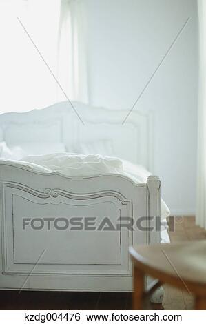 Wooden chair and bed View Large Photo Image Stock Photograph - Wooden chair and bed. Fotosearch