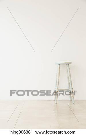 Wooden chair in a white room View Large Photo Image Stock Image - Wooden chair in a white room. Fotosearch