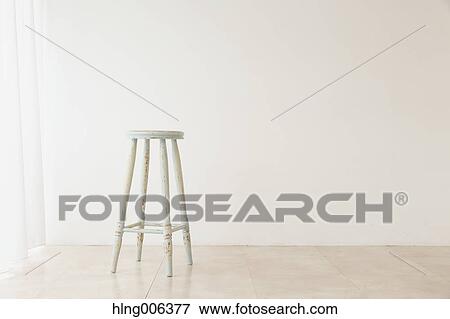 Wooden chair in a white room View Large Photo Image Stock Photo - Wooden chair in a white room. Fotosearch
