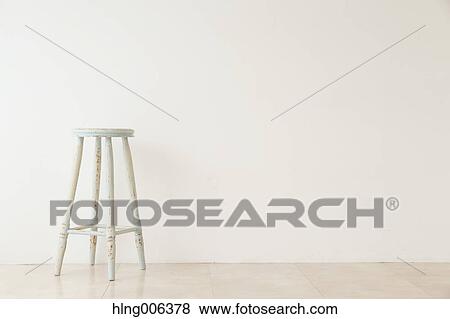 Wooden chair in a white room View Large Photo Image Stock Photo - Wooden chair in a white room. Fotosearch