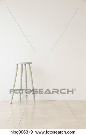 Wooden chair in a white room View Large Photo Image Stock Photo - Wooden chair in a white room. Fotosearch