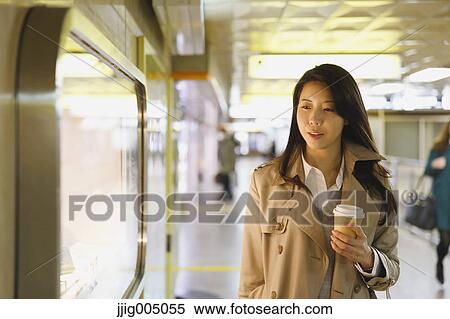 Young attractive Japanese woman at underground train station View Large Photo Image Stock Photography - Young attractive Japanese woman at underground train station. Fotosearch